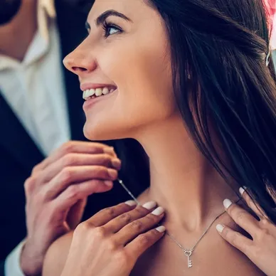 A shopper admiring jewelry